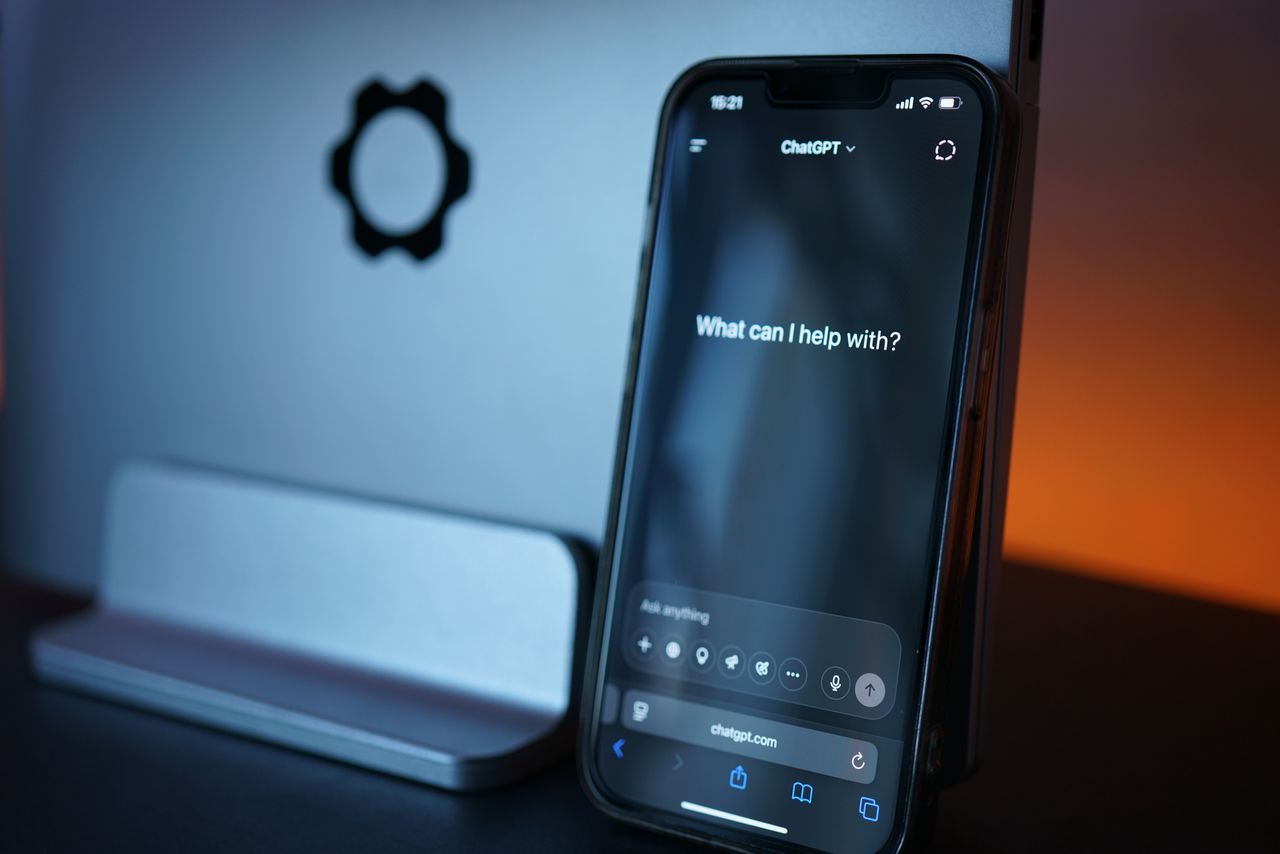 get-in-touch Close-up of a smartphone with AI chat interface, showcasing advanced technology in a sleek design.